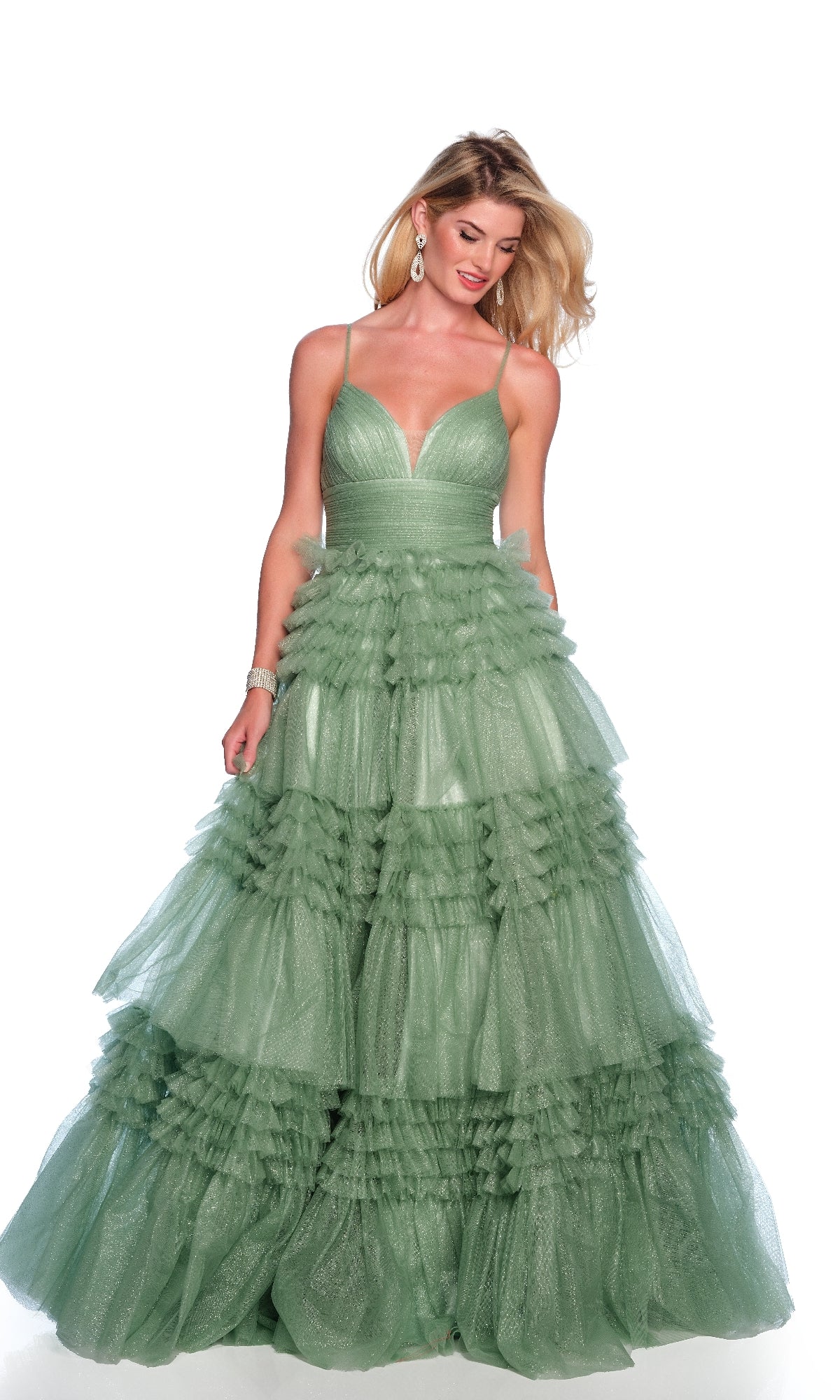 A woman stands against a white background wearing the Dave & Johnny 11994 Green Glitter Prom Dress, featuring spaghetti straps and a sleeveless, floor-length ruffle tiered A-line skirt in light green.